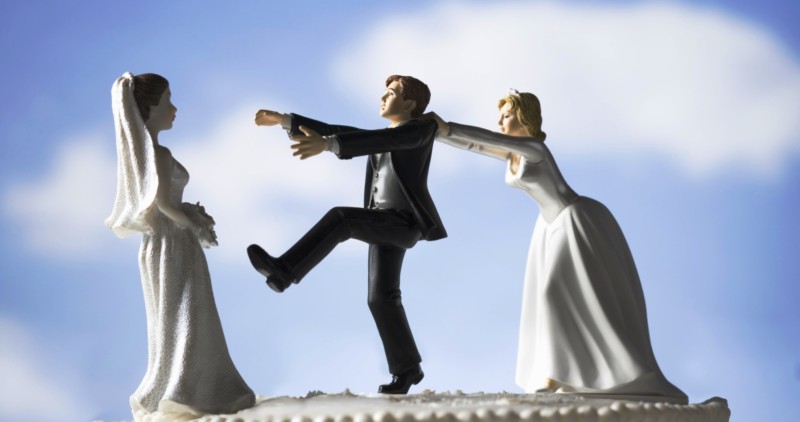 Wedding cake visual metaphor with figurine cake toppers